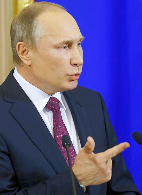 Putin mocks claims that Kremlin spied on Trump - Taipei Times