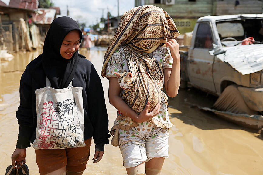 Survivors piecing back shattered lives in Indonesia