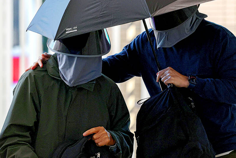 Court convicts father of HK activist