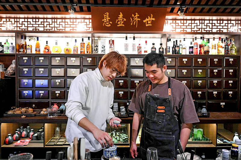 Youth mixing traditional medicine with cocktails