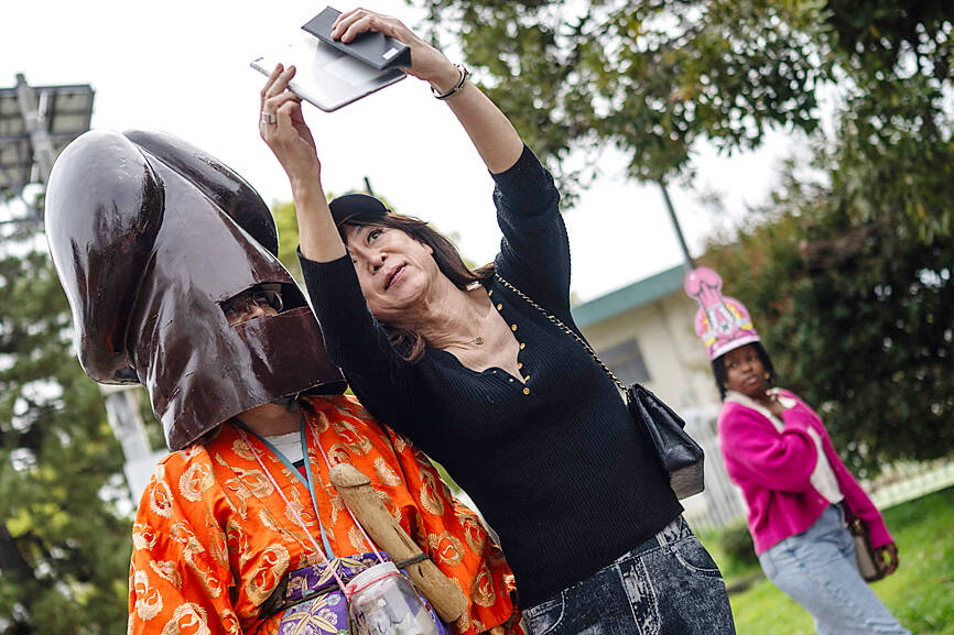 Revelers parade giant penises at fertility festival