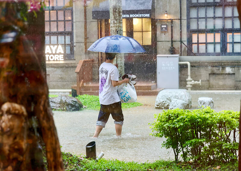 Heavy rain causes widespread flooding in Taipei