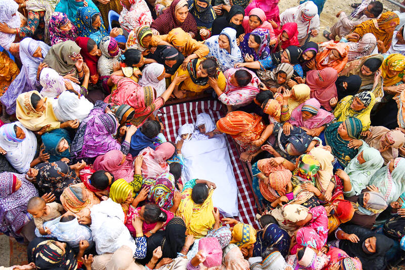 Mourners attend funerals for 14 Pakistani children killed in roof collapse